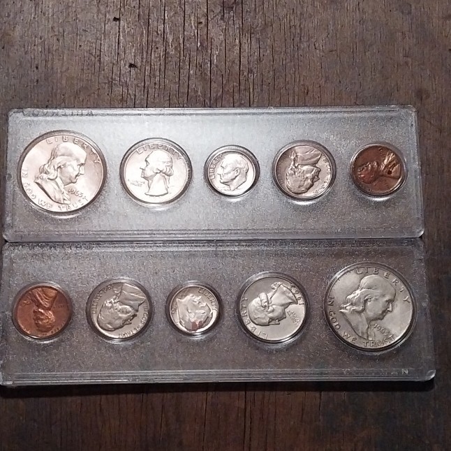 Two 1963 silver coin sets.  