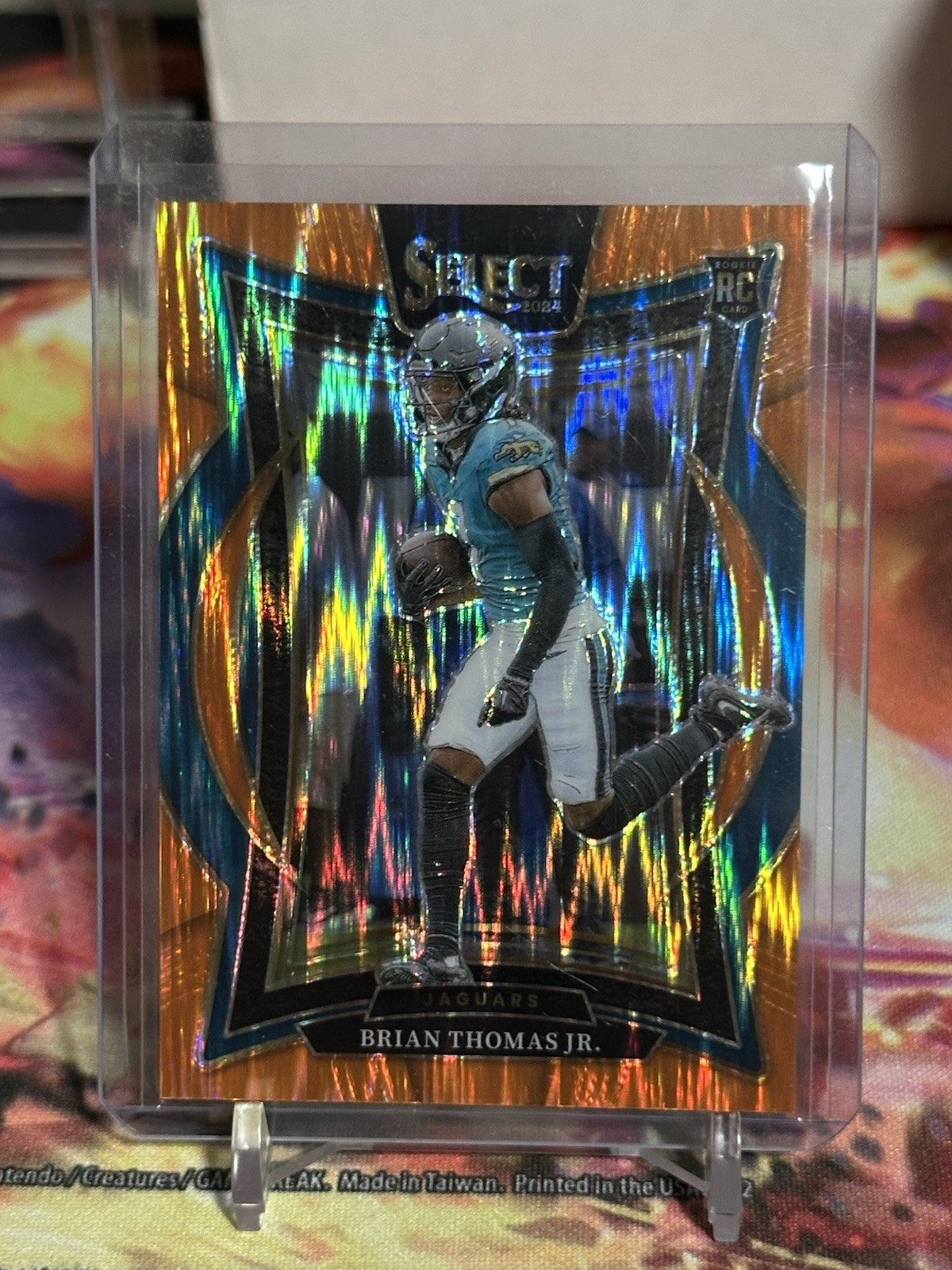 2024 Panini-Select #91 Brian Thomas Jr. Concourse Orange Shock Prizm RC /499