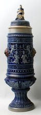 Good 19th C. German Metlach lidded urn vase having raised figured decoration