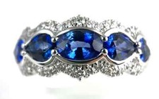 Features Five Royal Blue 1.85CT Sapphires With Clear White CZ Halo Wedding Ring
