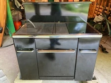 Monarch Coal-Wood Range. Back. Cast iron cook surface. Good condition.
