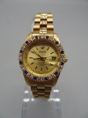 Ladies Gruen Watch 237-2015 Gold Tone Band Blue & Clear Rhinestone Bezel w/Day