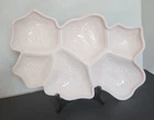 A vintage Jeannette Glass shell pink divided milk glass serving platter.