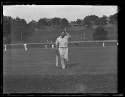 Batter Mr Forsbey running across cricket field clutching baggy gree- Old Photo