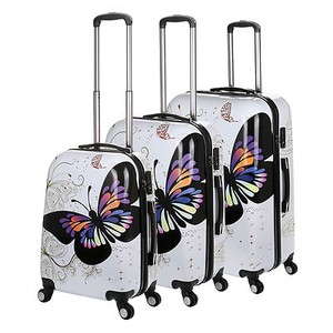 white hard shell luggage