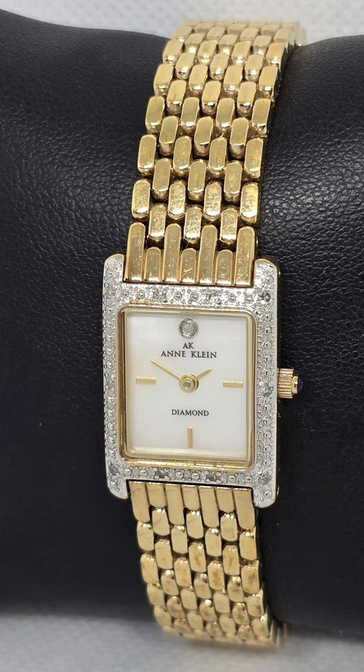 Reloj de cuarzo para mujer Anne Klein diamante tono dorado esfera mop correa 09 Foto 2 de 4