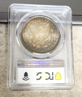 1884-O Morgan Dollar - Rainbow Toner - MS63 - PCGS - Nice Eye