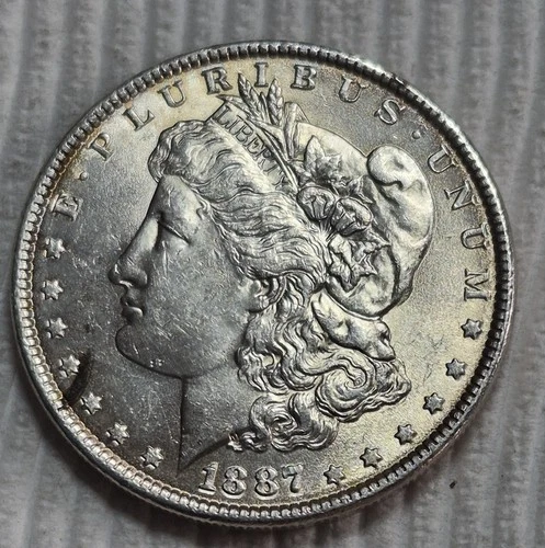 1887 P Morgan Silver Dollar Estimated Almost Uncirculated 58.  Die Cracks A0734