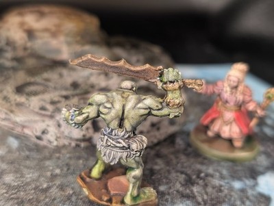 Well painted savage orc with raised sword d&d miniature by NLM