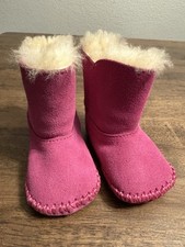 UGG Caden baby booties in fuchsia pink suede with sheepskin lining 0/1