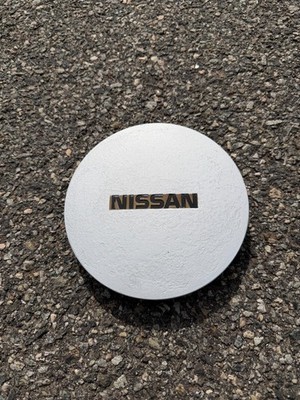 One factory 1989 1990 Nissan Maxima center cap 40315-94E00