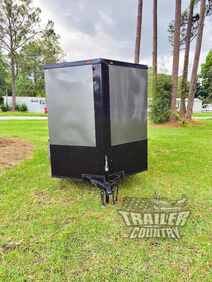 Remolque cerrado de carga para motocicletas 2025 6x12 6x12 nariz en V negro nuevo con rampa Foto 3 de 4