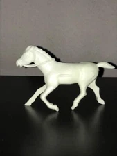 60mm REL Western Horse with ridges on side in White Soft Plastic.   Light wear