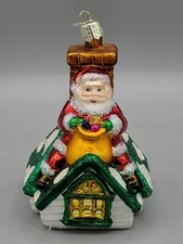 2001 Old World Christmas Ornament  Merck Family’s, Santa On Roof W/Presents