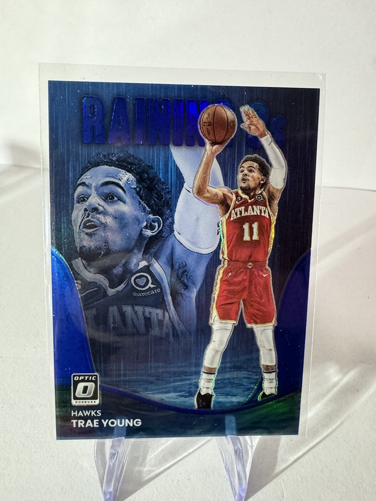 2022-23 Donruss Optic Raining 3s Blue #8 Trae Young /49