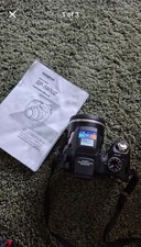 Olympus SP-590UZ digital camera. 12 megapixel, 26x zoom