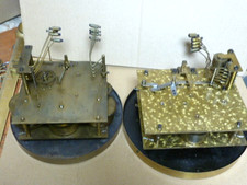 2 large old 1/4 striking 5 & 8 hammer movements & dials