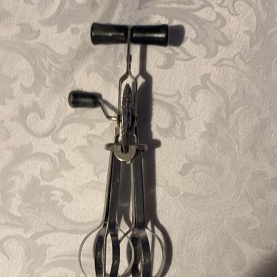 Manual Stainless Steel Handheld Mixer with Black Handles and Beater