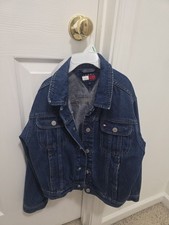 Vintage Tommy Hilfiger Kids denim trucker jacket in a classic dark blue wash....