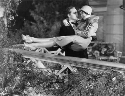 Alexander Gray sweeps Inez Courtney off feet a scene Rodgers - 1930 Old Photo