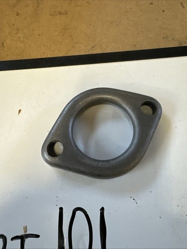 Round steel Walker exhaust flange with smooth center and two circular mounting holes, made in the USA.