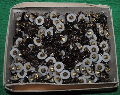 A box containing several hundred small vintage buttons for doll clothes, Germany
