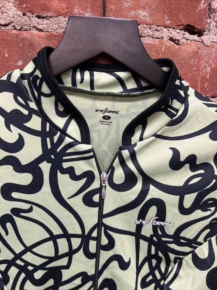 Jersey de ciclismo Shebeest para mujer pequeño cremallera completa verde negro manga corta bolsillos Foto 2 de 3