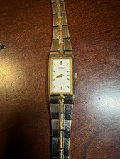 Seiko 2E20-7479 Women’s Rectangular Analog Quartz Watch White Dial Gold/Silver