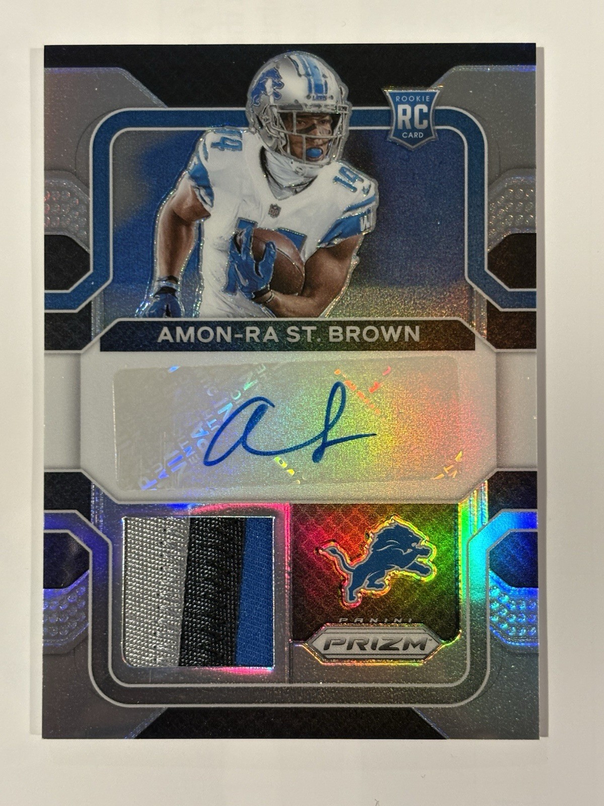 Amon Ra St. Brown #RPA-AB Football Cards 2021 Panini Prizm Rookie Patch Autographs trading card — raw and PSA graded price guide