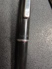 Black Eversharp mechanical pencil with silvertone trim, blue “Eversharp” text, and twist-out pen refills on a textured surface.