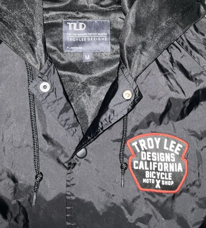 Troy Lee Designs California Bicicleta MotoXShop Cortavientos con Capucha A Presión Mediana Foto 3 de 4