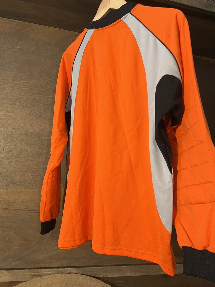CAMISA DE COMPRESIÓN REUSCH ADULTO BRAZOS ACOLCHADOS TALLA PEQUEÑA NARANJA GRIS NEGRO USADA EN EXCELENTE ESTADO Foto 4 de 4