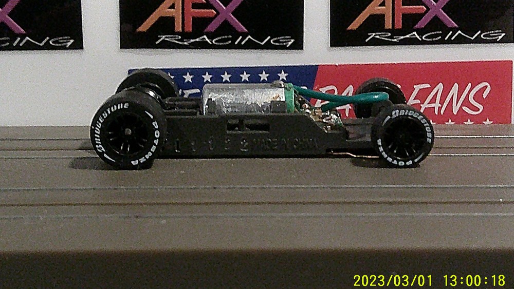 AFX Racing HO Scale Mega G+ Narrow Chassis Black Inline Rims Lettered Tires