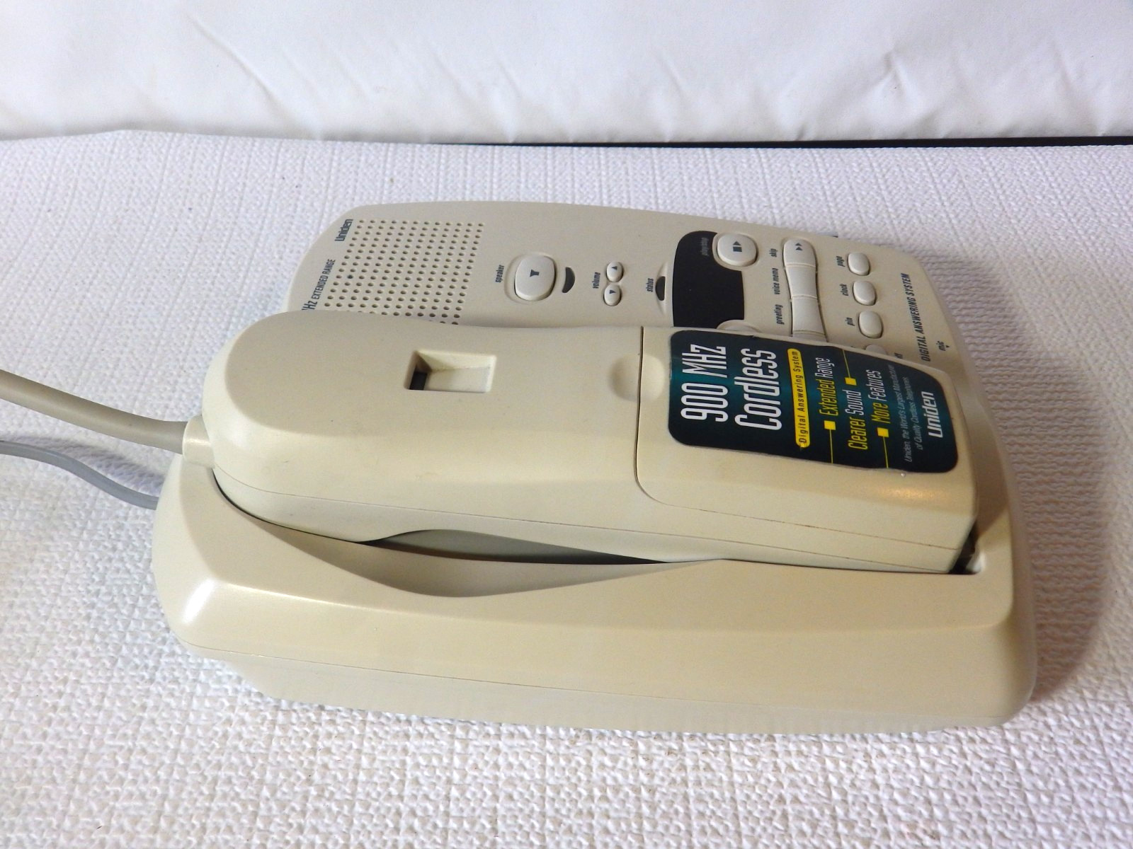 Vintage Uniden 900 MHz cordless phone with a digital answering system.