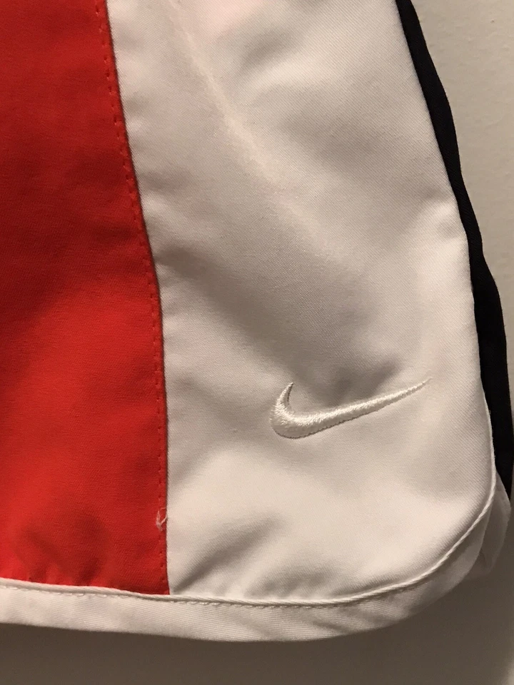 Pantalones cortos para correr Nike naranja y blanco para mujer talla pequeña 4-6 Foto 2 de 4