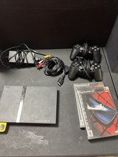 PlayStation 2 Slim With 2 Controllers, Cords, 1 Memory Card And 2 Games Works