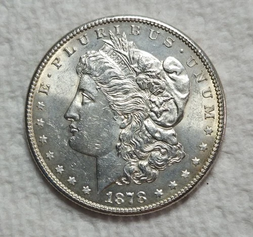 1878 S Morgan Silver Dollar. Estimated Uncirculated Mint State.  Video M0077.