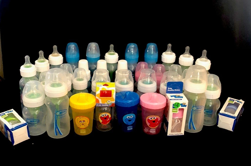 35 (Or Around There) Plastic Baby Bottles And A Few Sesame Street Sippy Cups