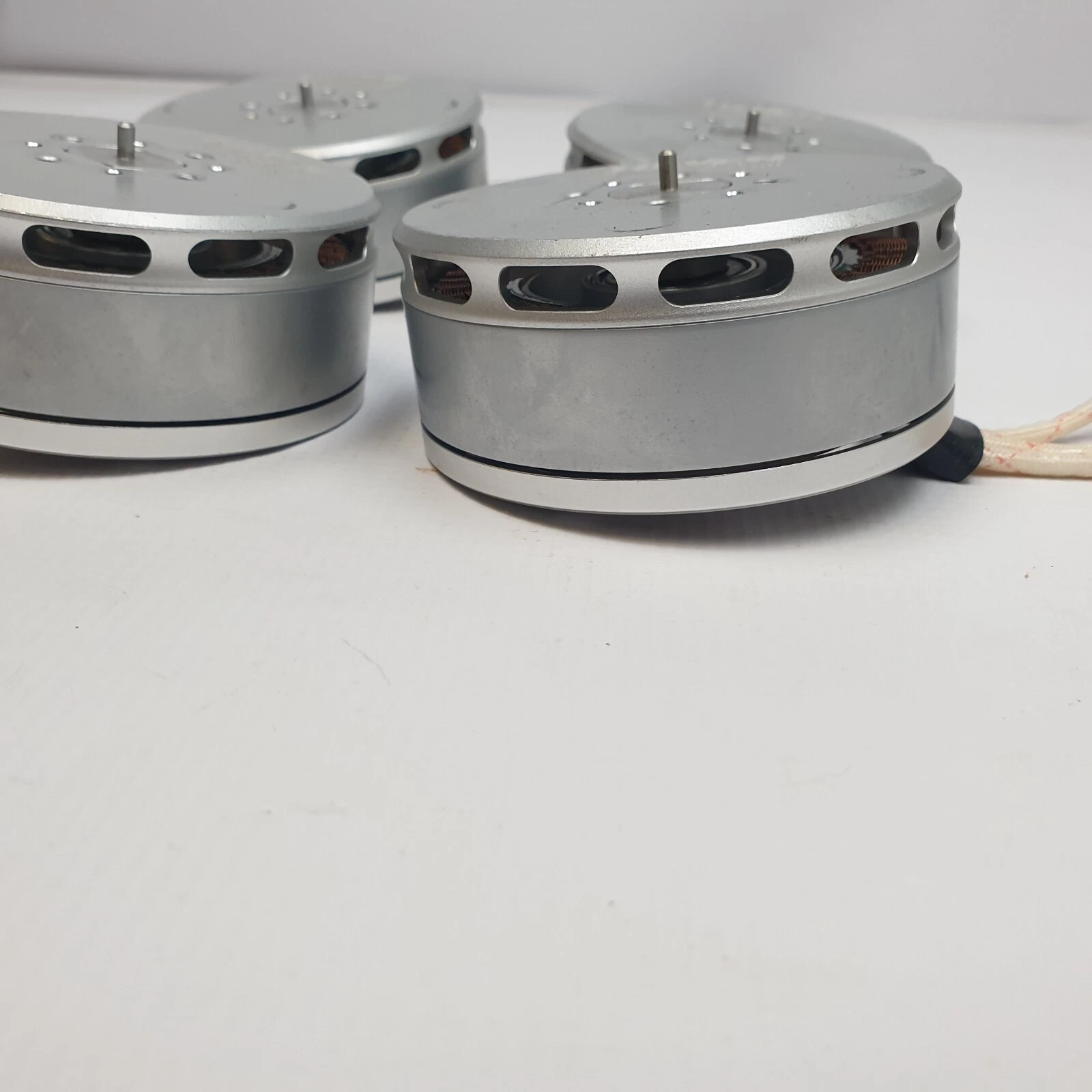 Side view of the KV100 motors showing the vented silver housings and center shafts