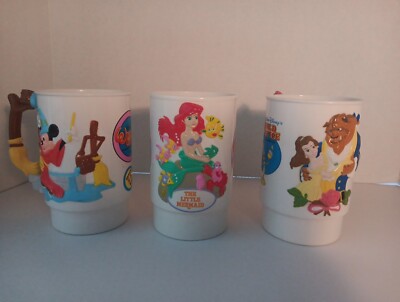 vintage 3 Disney world on ice cups and vintage barnum and bailey tin man cup LOT