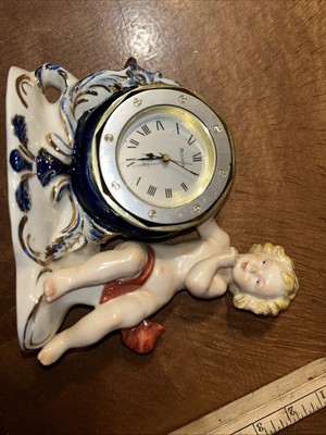 Elegant cherub Clock Bulova Movement Porcelain Stamped With A Crown Over GDR ￼