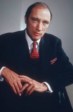Canadian Prime Minister Pierre Trudeau wearing a navy suit with a r- Old Photo