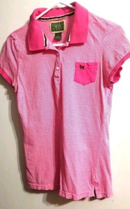 white polo shirt with brown horse