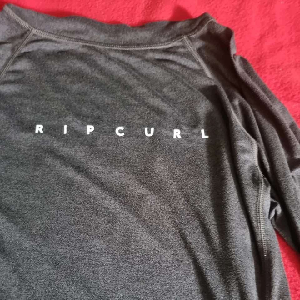 Rip Curl wet suits Gr.xs UPF 50+ Perf. Langarm Shirt / body anthrazit - Bild 2 von 4