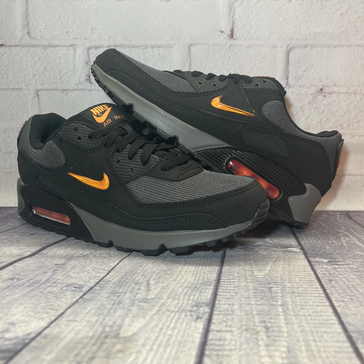 Black 'shoes with orange clearance swoosh