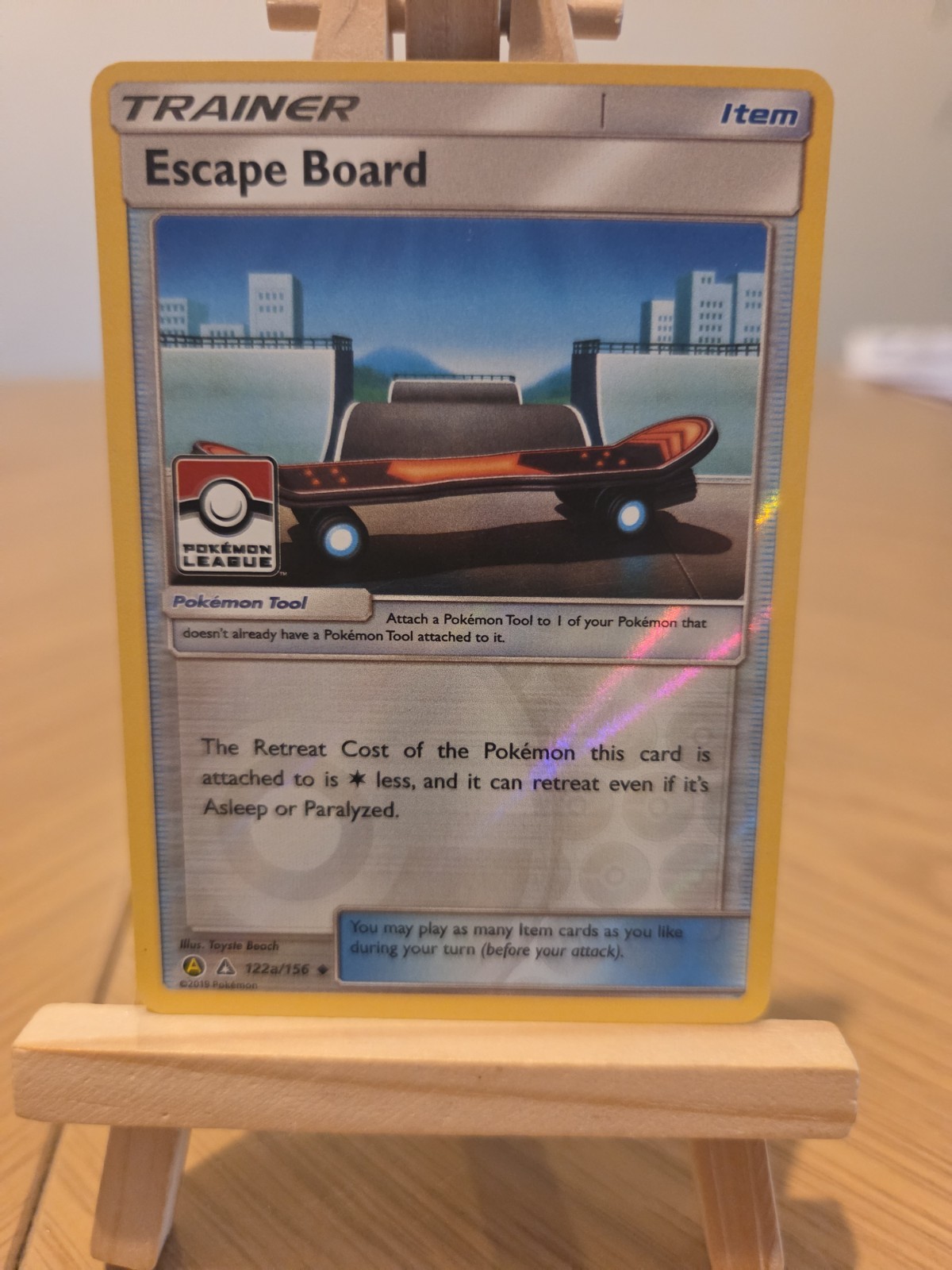 Pokemon Escape Board 122a/156 - League Promo Holo - SM Ultra Prism