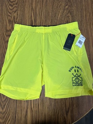 Neon Yellow Roark Run Amok shorts feature a large graphic on the leg