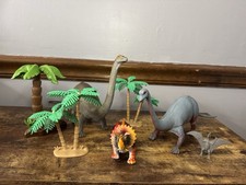 Lot Of 4 Plastic Dinosaurs  3 Plastic Trees