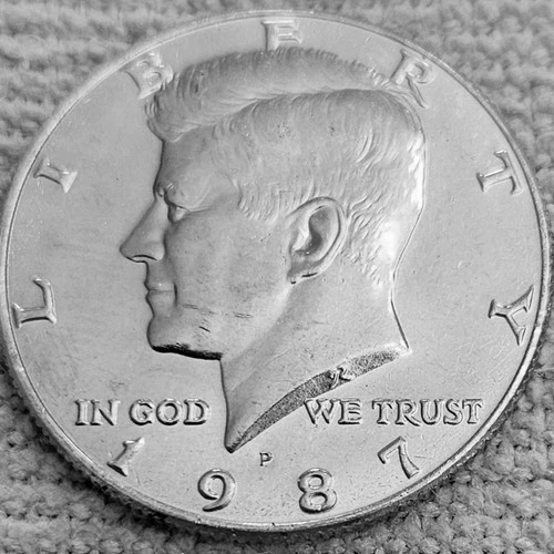 1- 1987 P Kennedy half dollar coin
