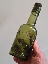 PICTORIAL HALF PINT OLIVE AMBER BEER BOTTLE FROM SHREWSBURY IN GOOD CONDITION.